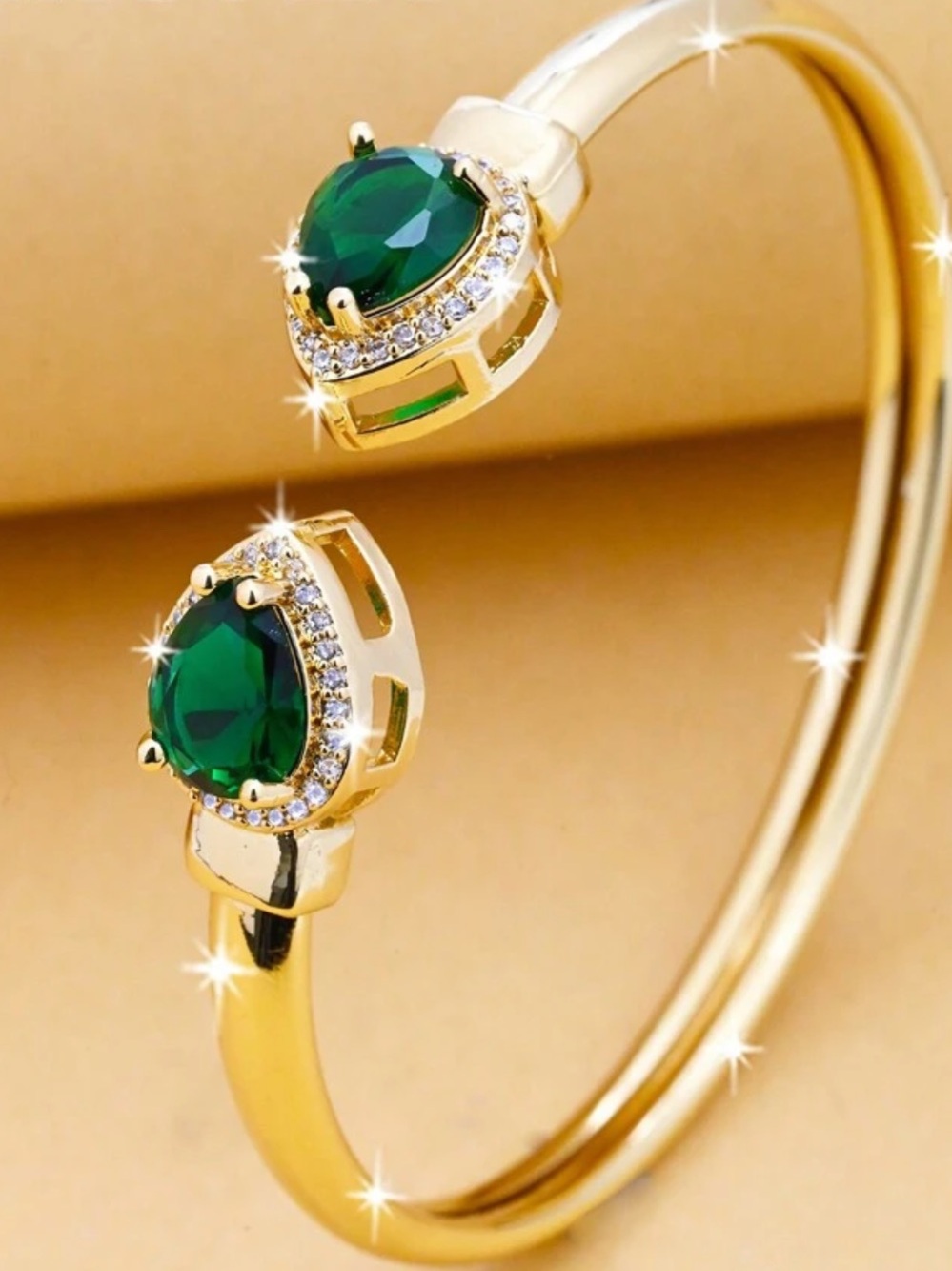 Gold Cuff Bracelet with Emerald Green Teardrop Stones